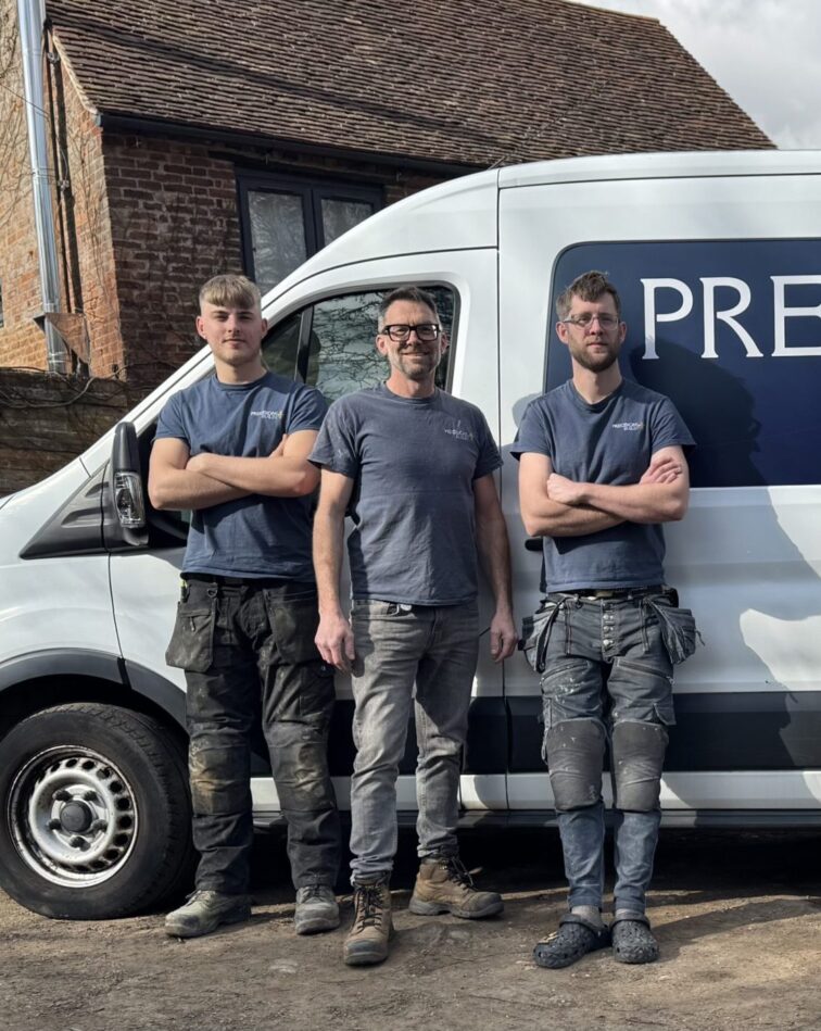 The original Precision Build team standing by first van